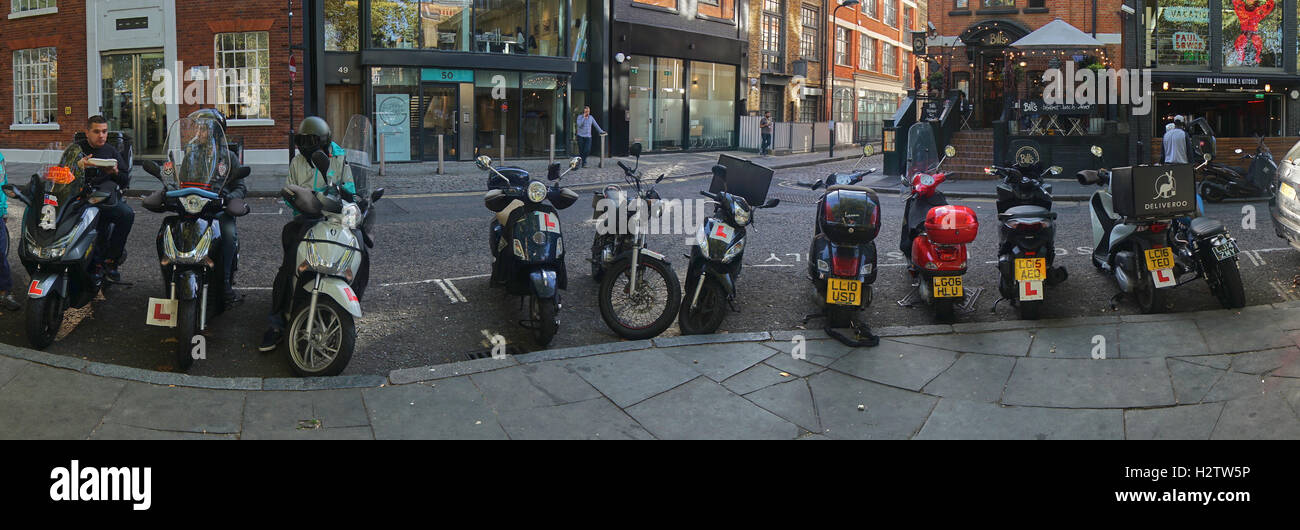 scooters,  row of scooters in hoxton  delivery scooters Stock Photo