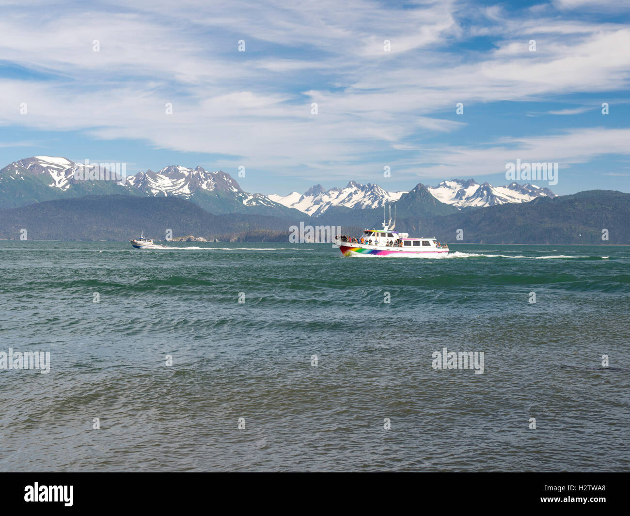 A tour boat returns to harbor; Homer Spit, overlooking Kachemak Bay