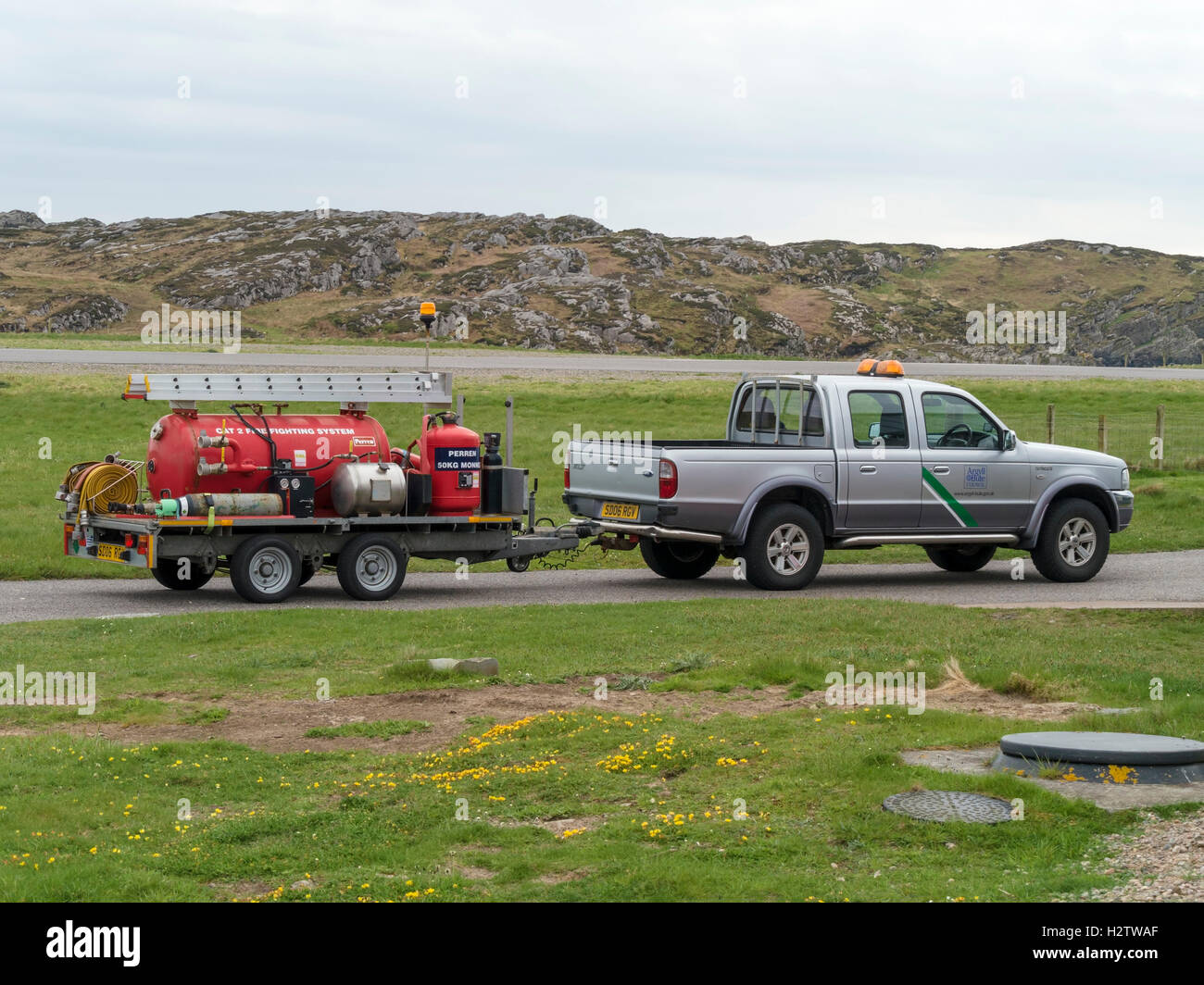 Small emergency fire tender with fire fighting system on trailer, Isle of Colonsay aerodrome, Colonsay, UK. Stock Photo