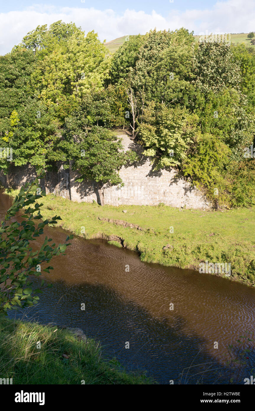 The abutment of an abandoned railway bridge over the river Wear at Frosterley, Weardale, Co. Durham, England, UK Stock Photo