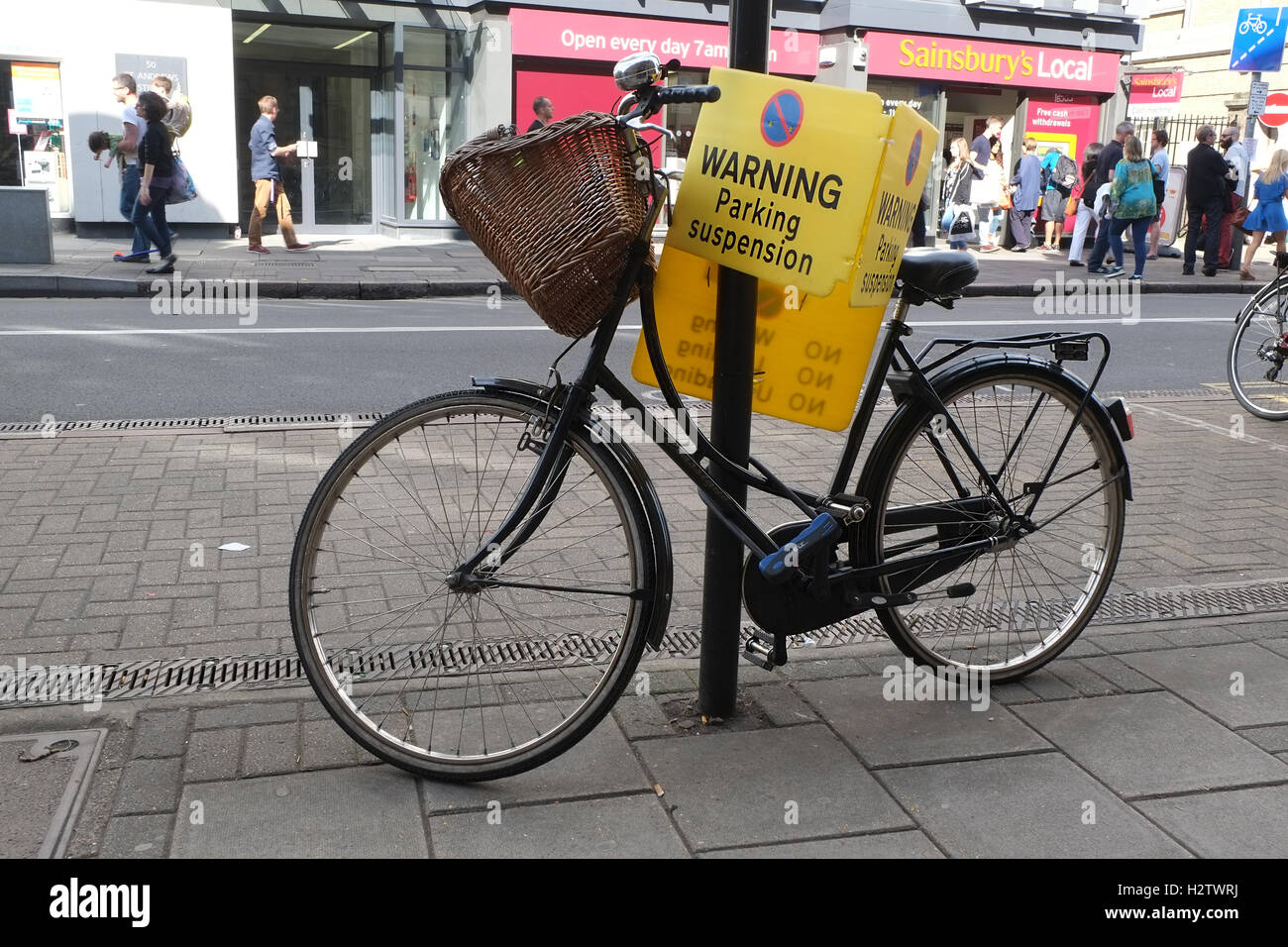 6th July 2014, ladies bike locked to a suspended parking sign in