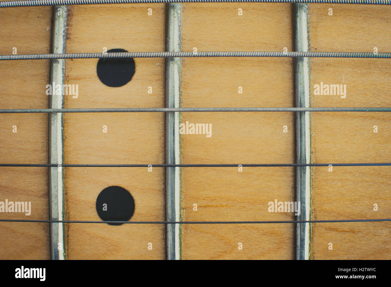 Electric guitar neck and couple of marker points detail view from the top Stock Photo