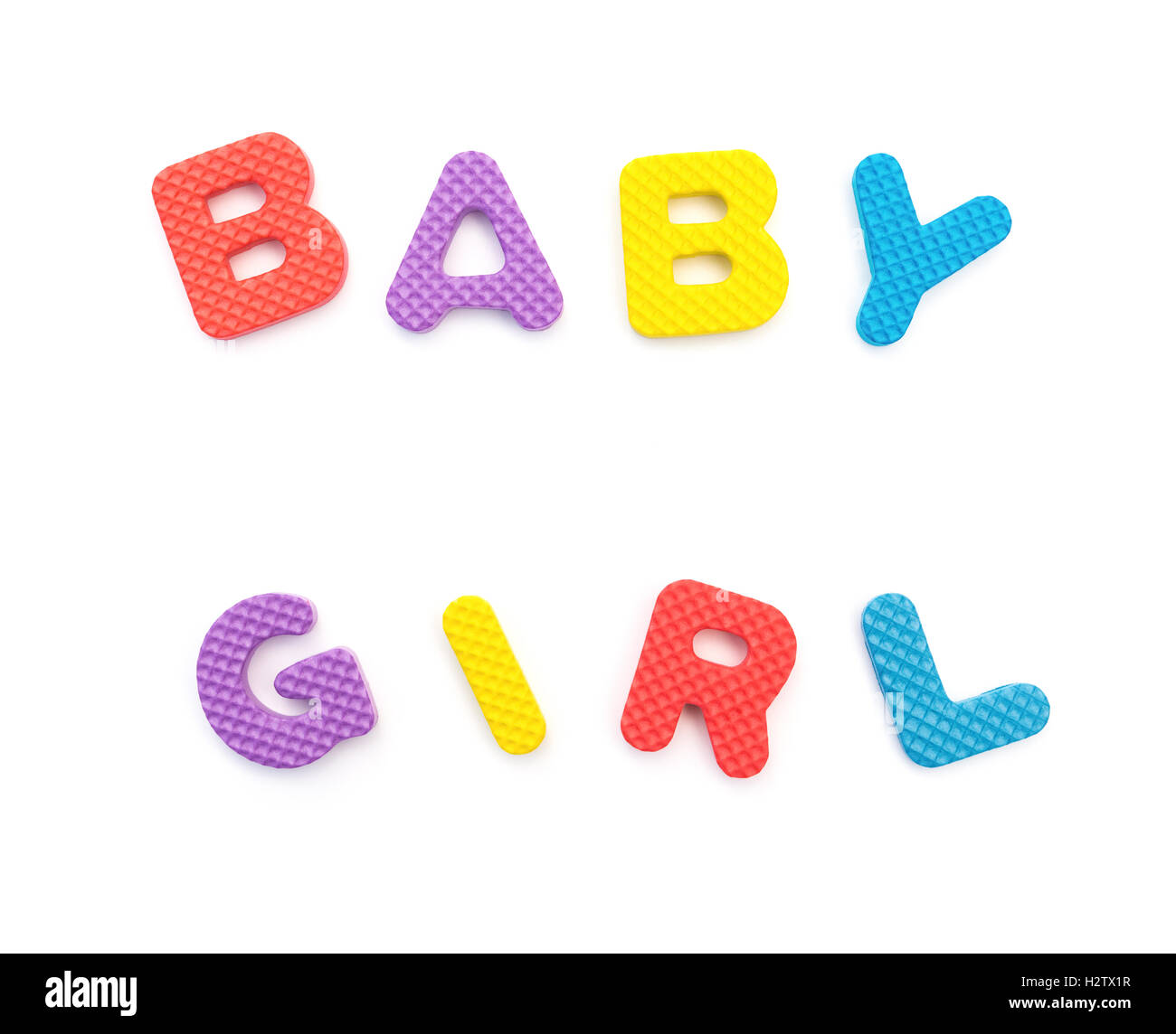 word of baby girl shaped by alphabet puzzles on white Stock Photo