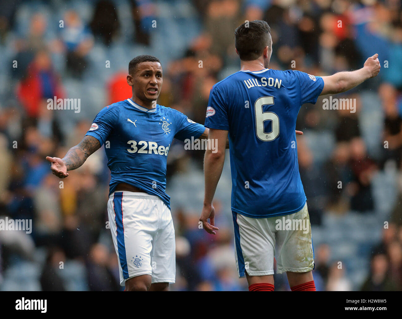 Rangers' James Tavernier (left) and Danny Wilson have words at the end ...