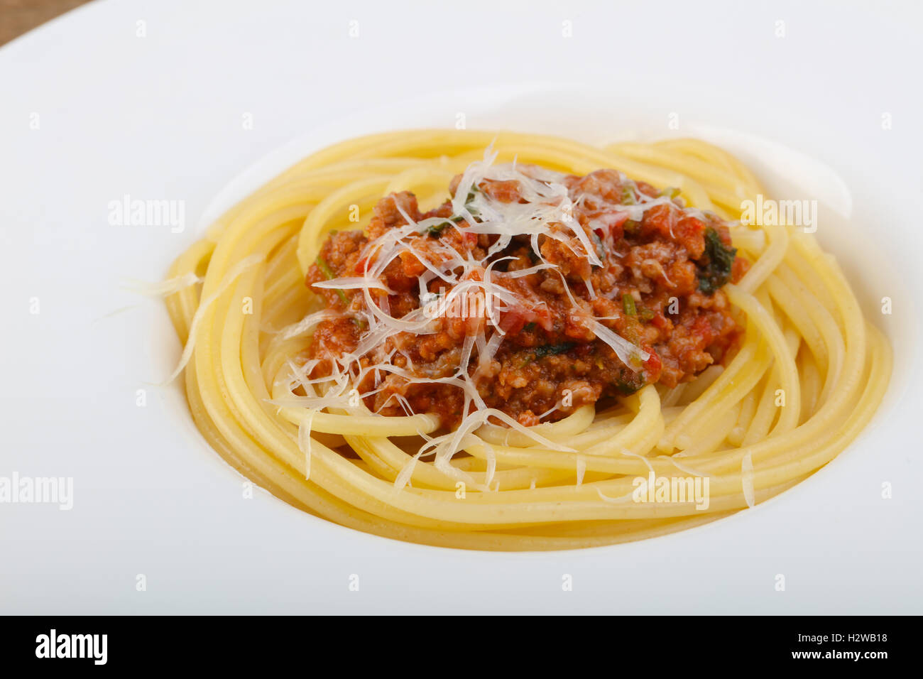Spaghetti bolognese with parmesan and basil leaves Stock Photo Alamy