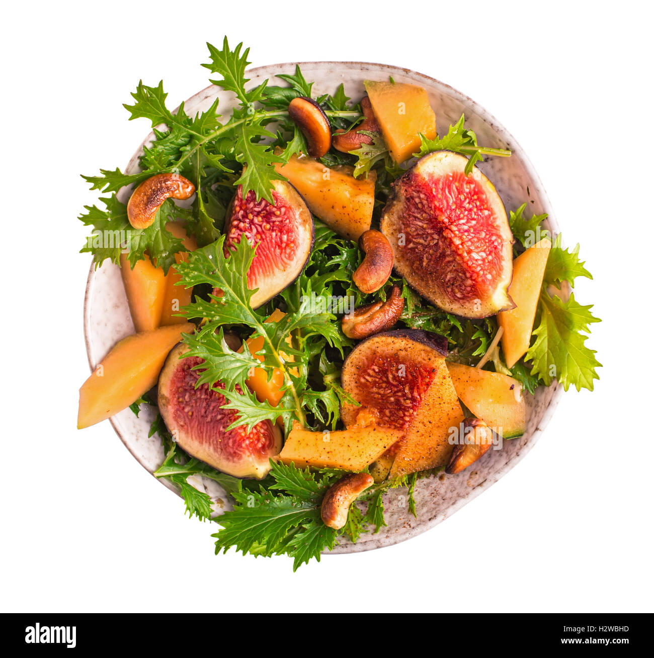 Fig and melon salad with mizuna isolated Stock Photo