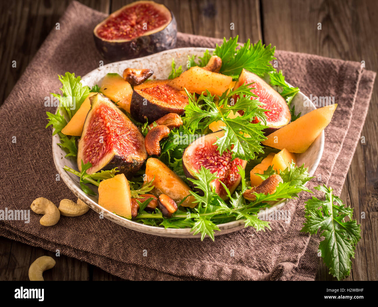 Fig and melon salad with mizuna Stock Photo