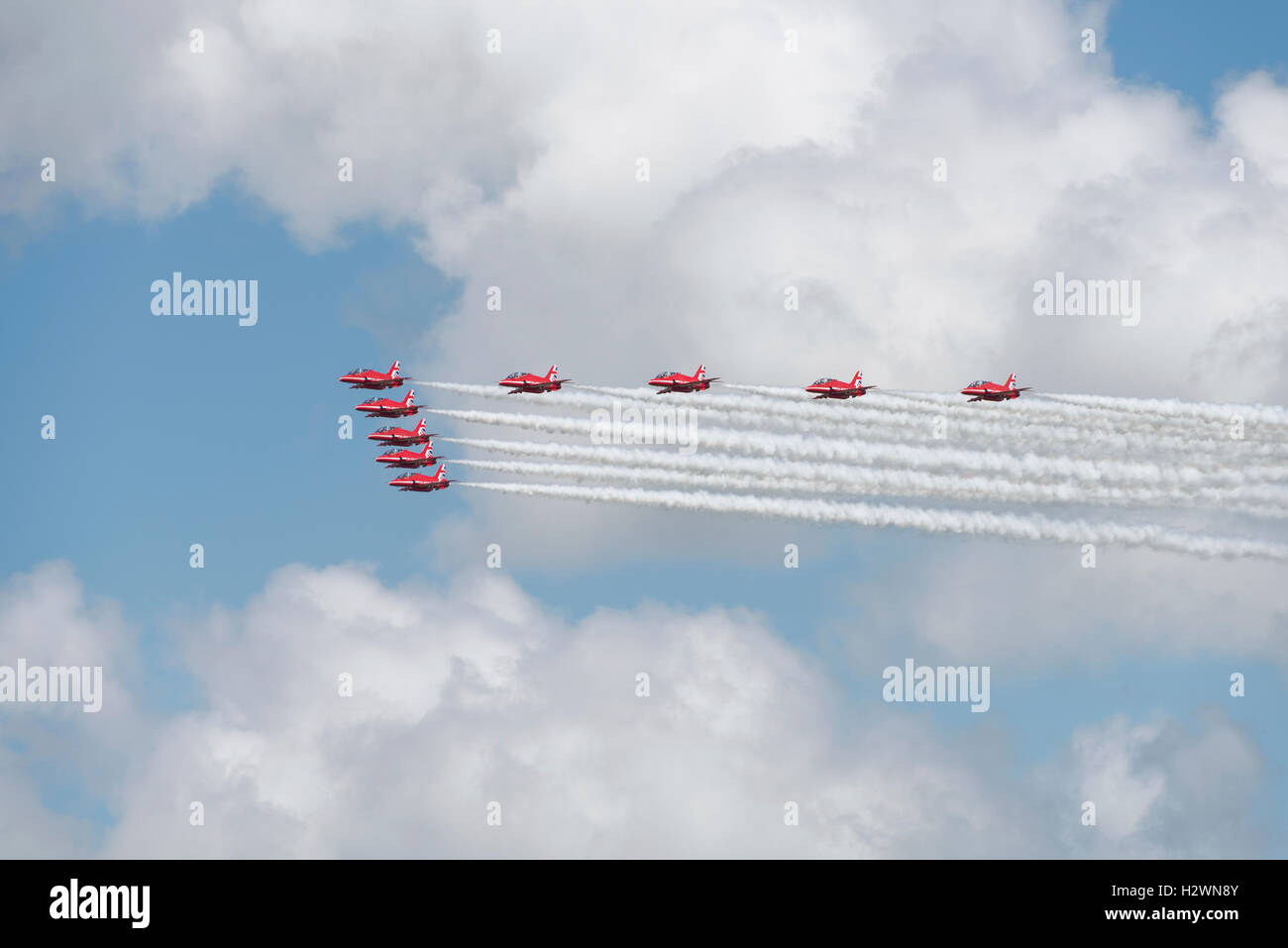 The RAF Red Arrows military aerobatic display team arrive in Big Battle Formation before breaking to land at the 2016 RIAT Stock Photo