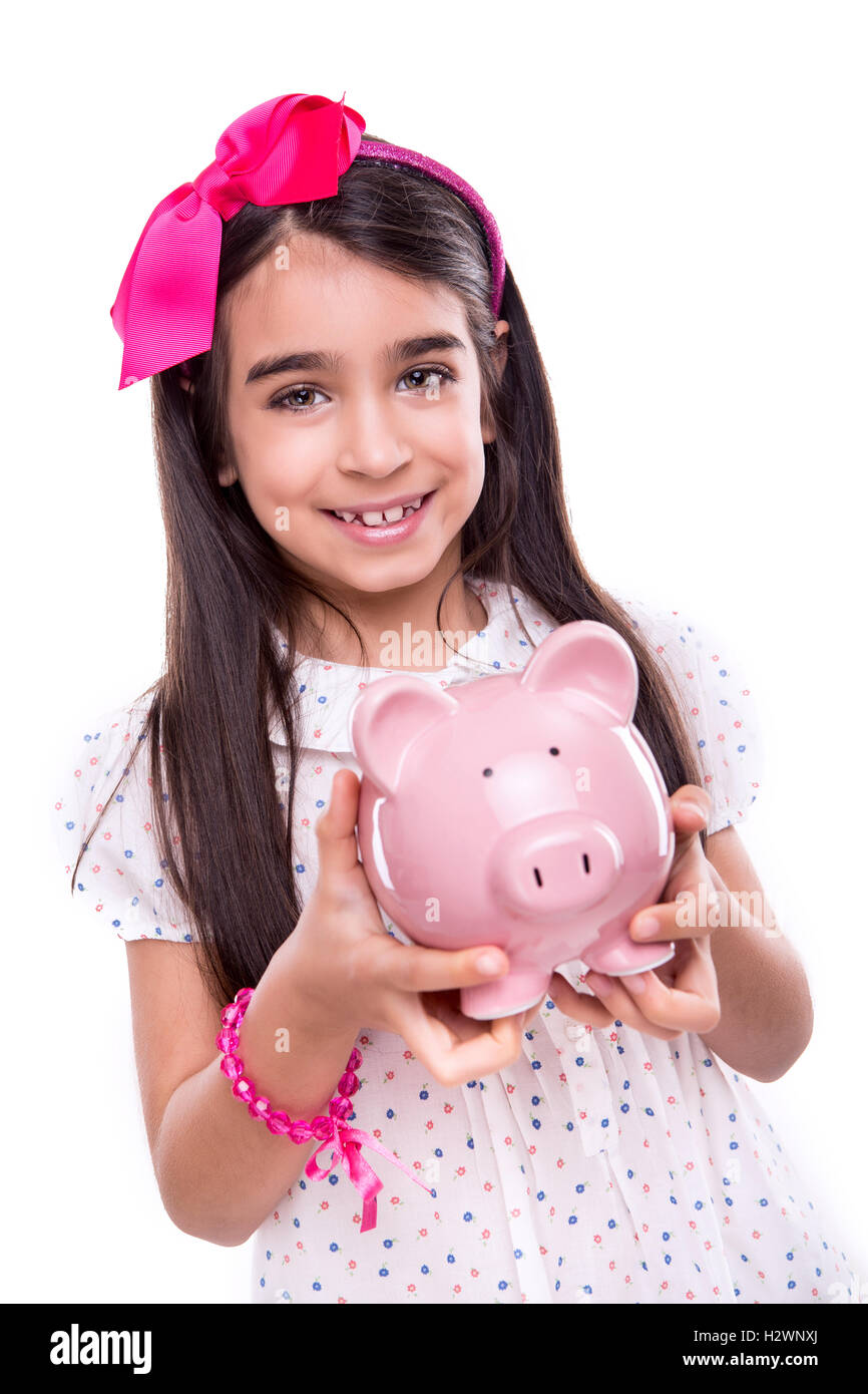 Girl holding a piggy bank Stock Photo - Alamy