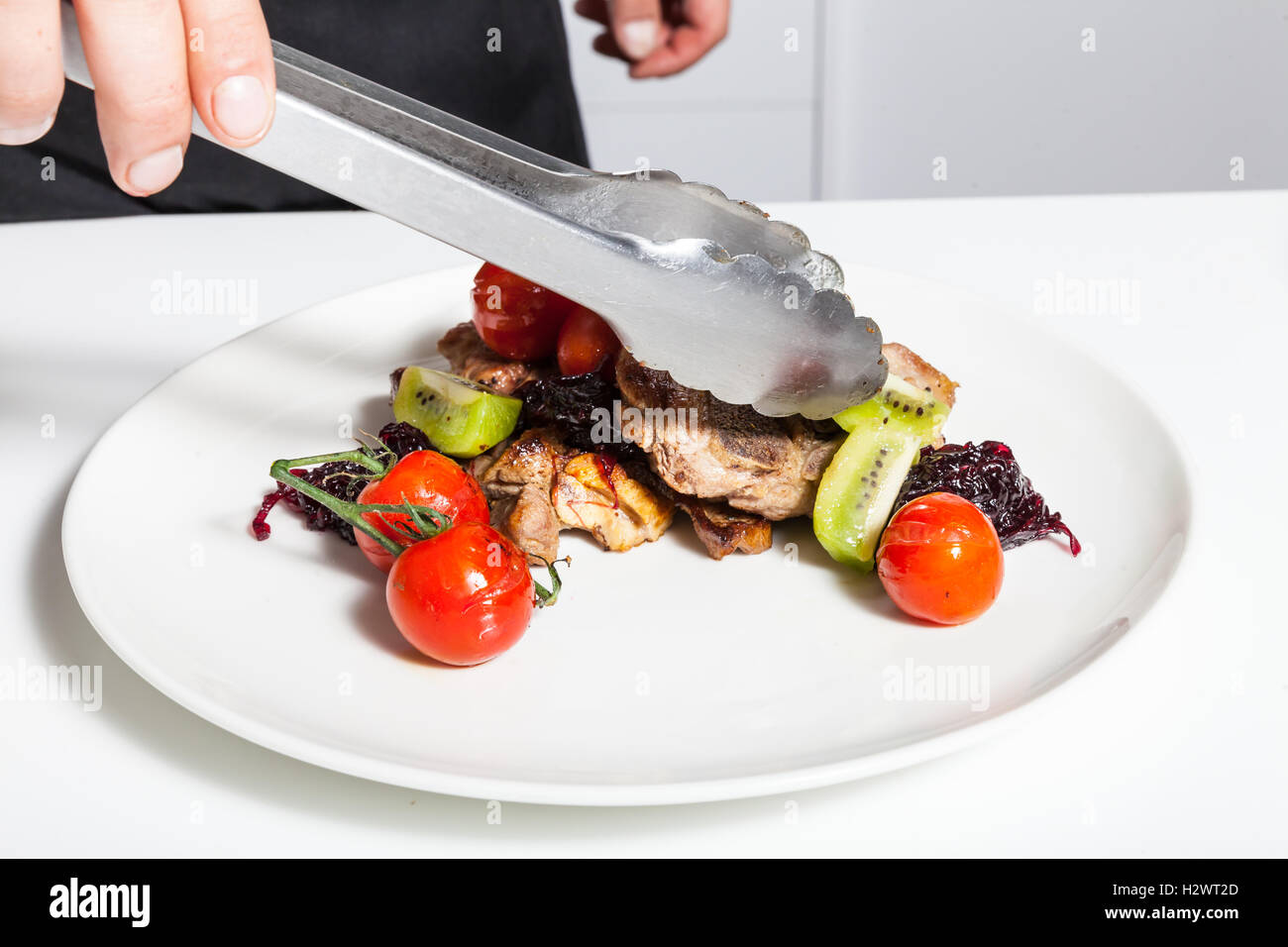 Man decorating dish Stock Photo Alamy