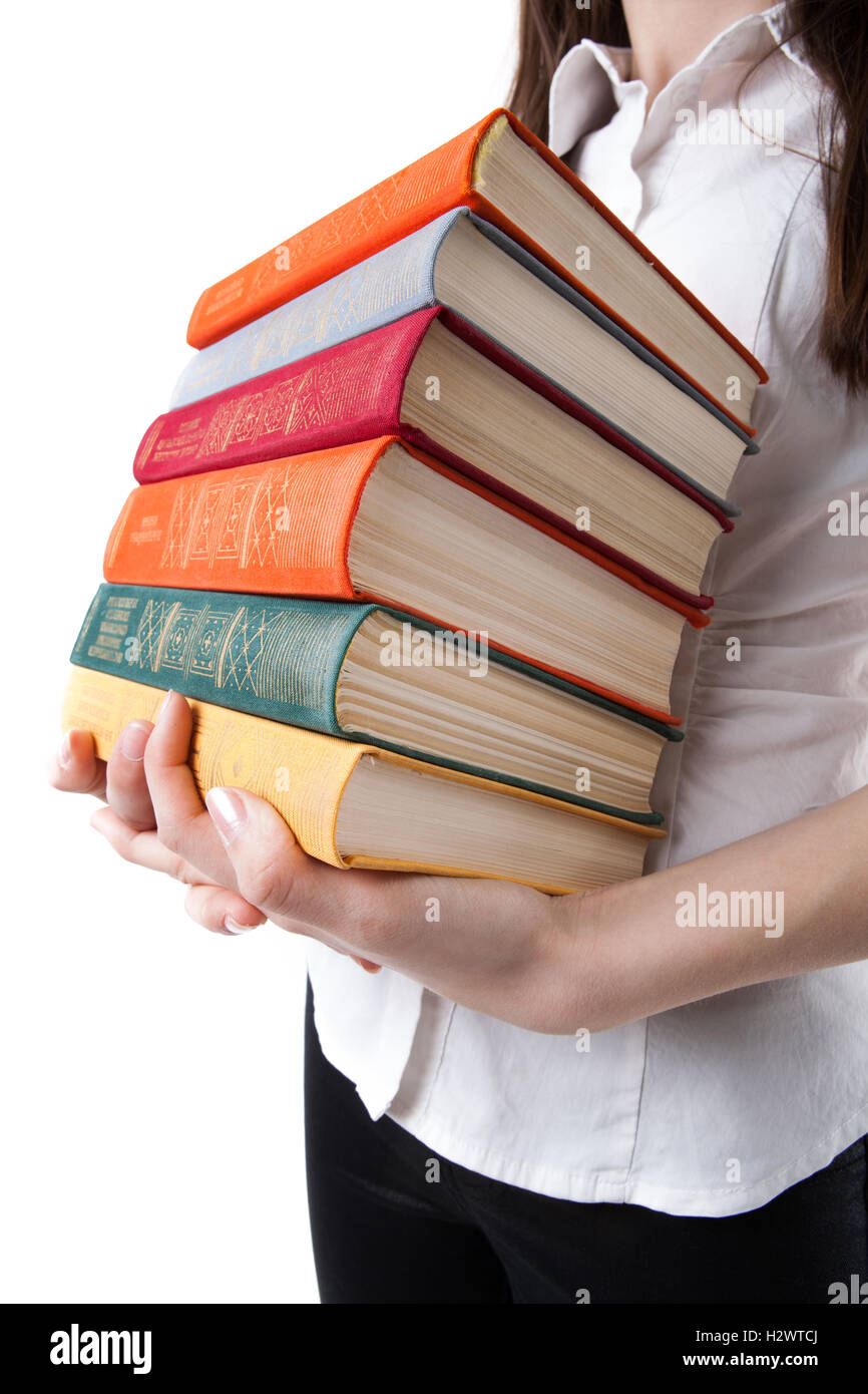 young girl holding a stack of books Stock Photo - Alamy
