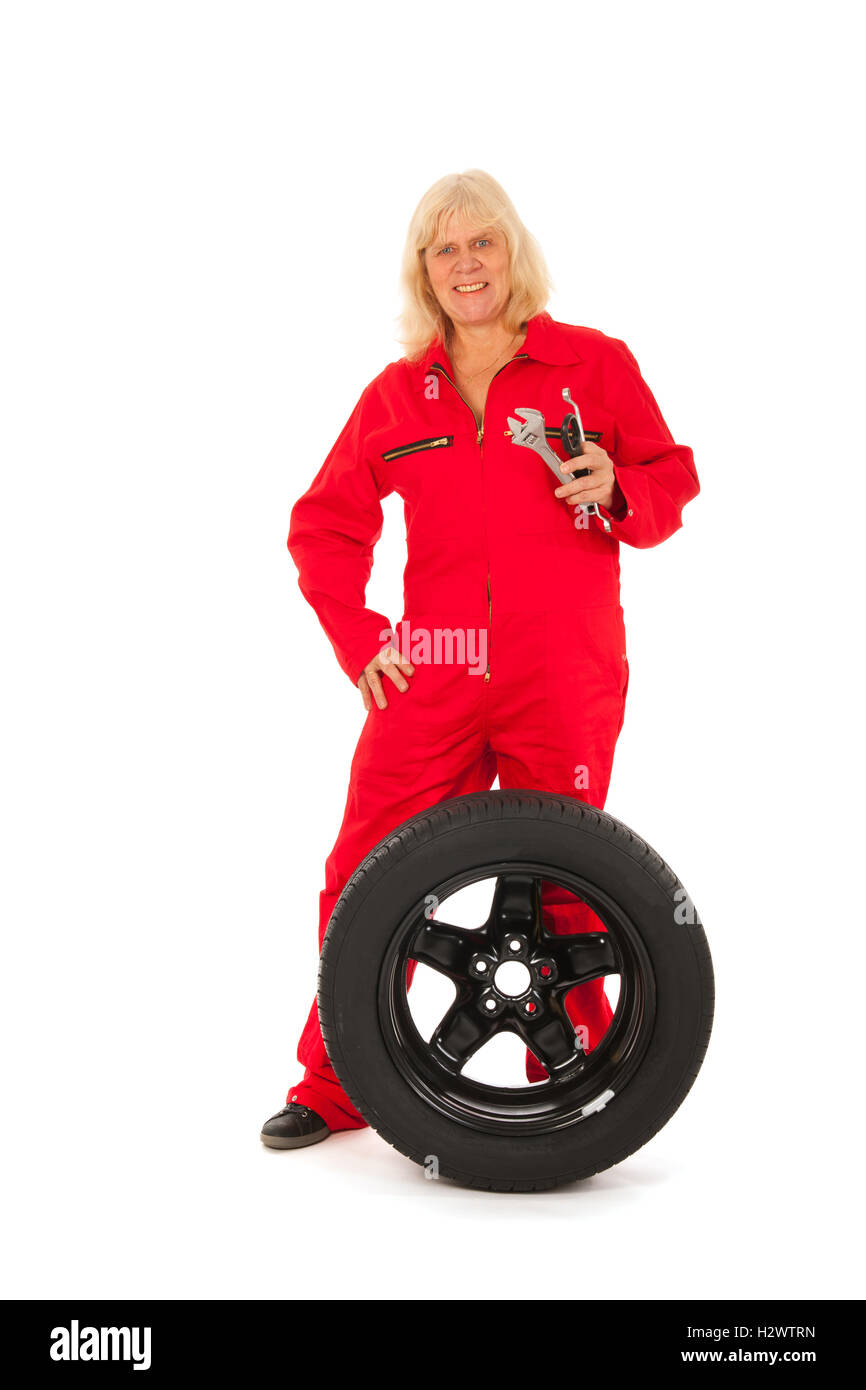 Female car mechanic with wheel Stock Photo