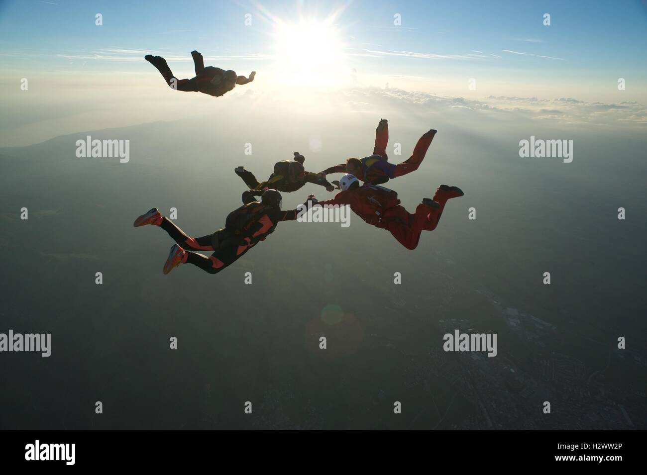 A skydiver closing in on a formation in freefall Stock Photo