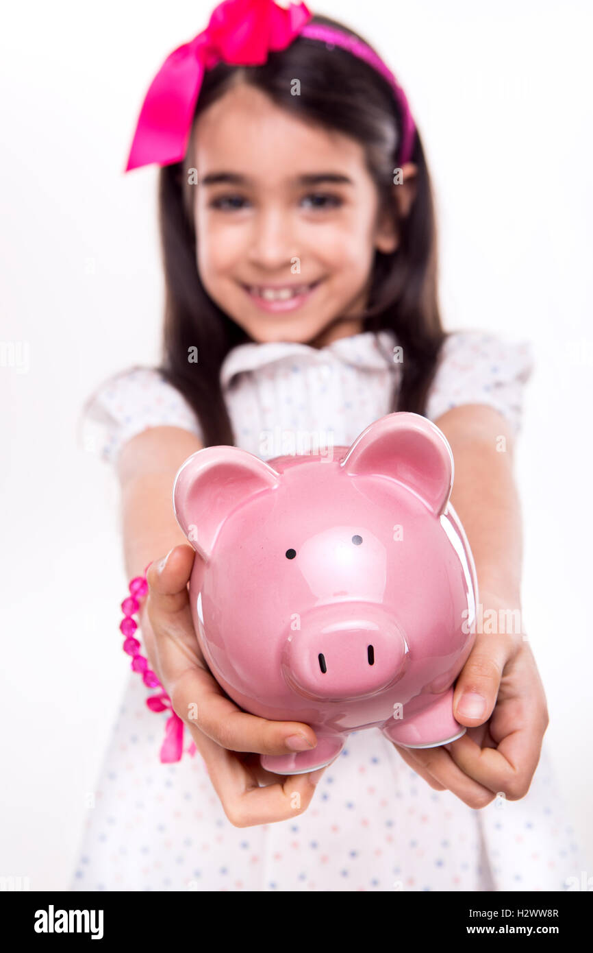 Girl holding a piggy bank Stock Photo - Alamy