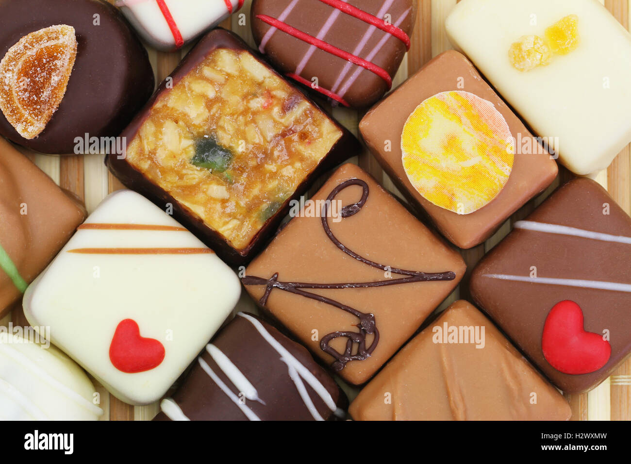 Background made of assorted chocolates, trifles and pralines Stock Photo