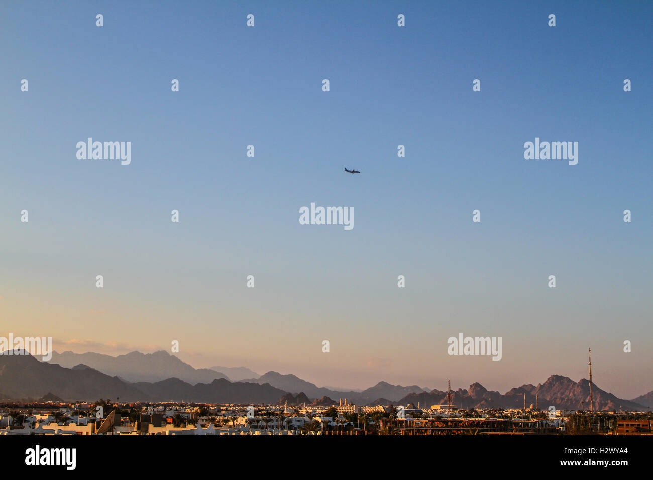 Plane at sunset Stock Photo - Alamy