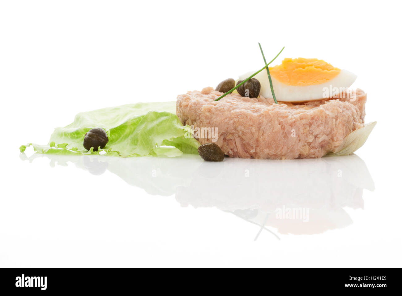 Tuna with eggs and salad isolated on white background Stock Photo - Alamy