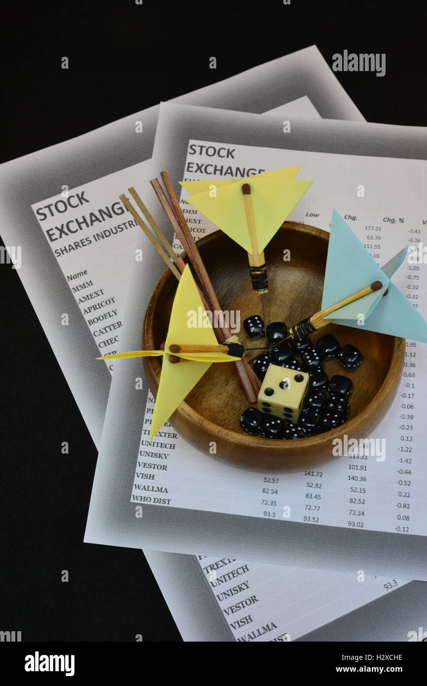Asset selection using random methods. Investment selection using darts, dice,  or drawing straws. Stock Photo