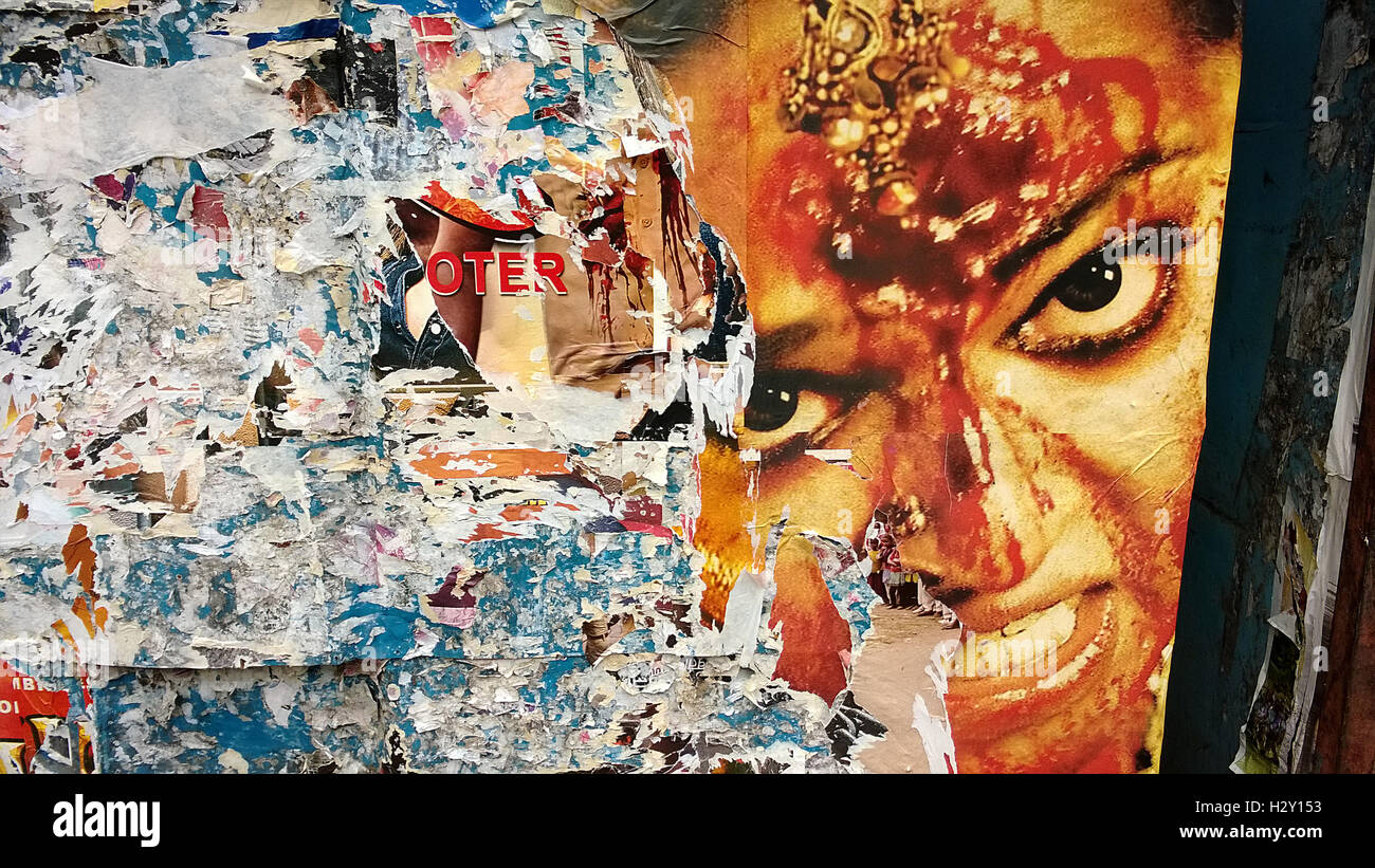 angry woman on Tattered hindi film poster in mumbai india Stock Photo