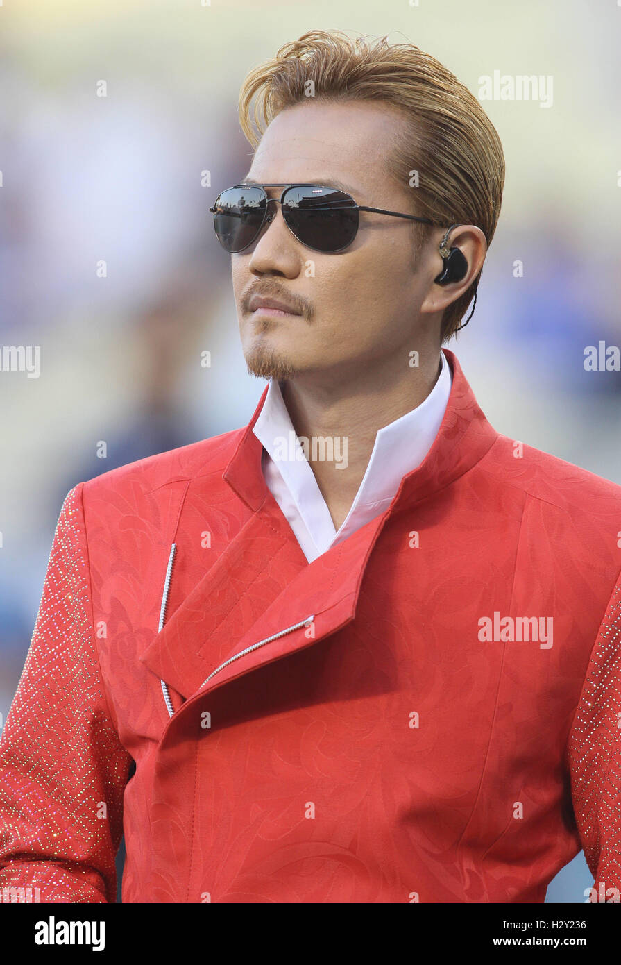 Exile Atsushi sings the Japanese national anthem on Japanese night at the  Dodger's stadium. The Los Angeles Dodgers defeated the Tampa Bay Rays by  the final score of 3-2. Featuring: Exile Atsushi