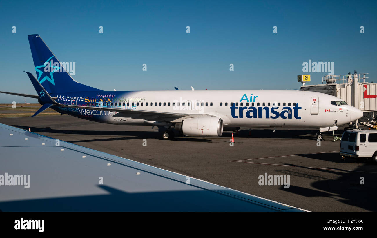 Air Transat Boeing 737-800 C-GTQF docked at a departures/arrivals gate airport terminal Vancouver International Airport,Canada. Stock Photo