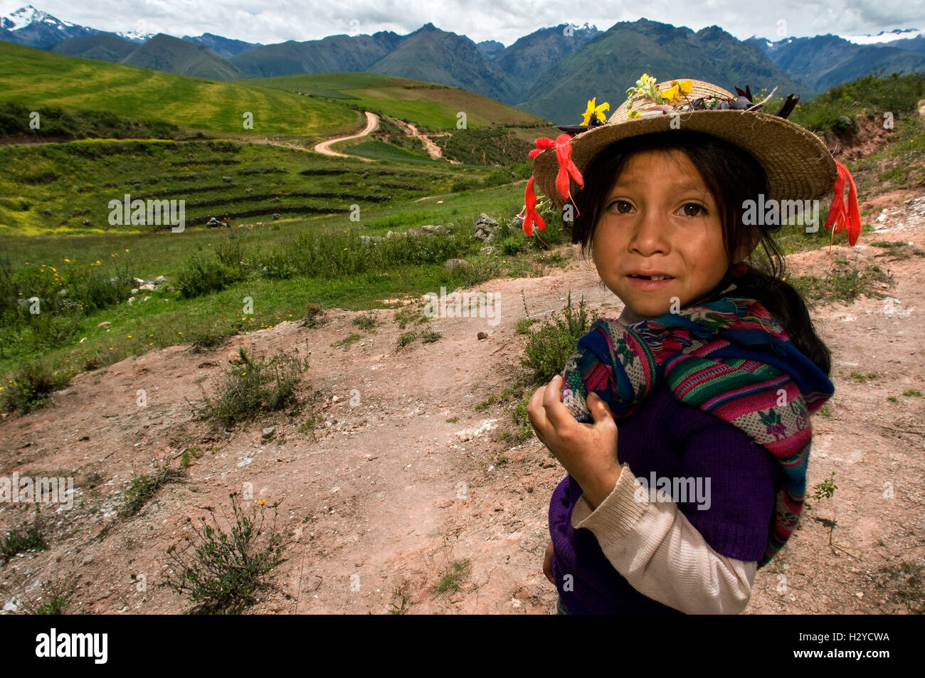 A girl in the archaeological site of Moray in the Sacred Valley near Cuzco. Moray - is the name of the Incan ruins near the town Stock Photo