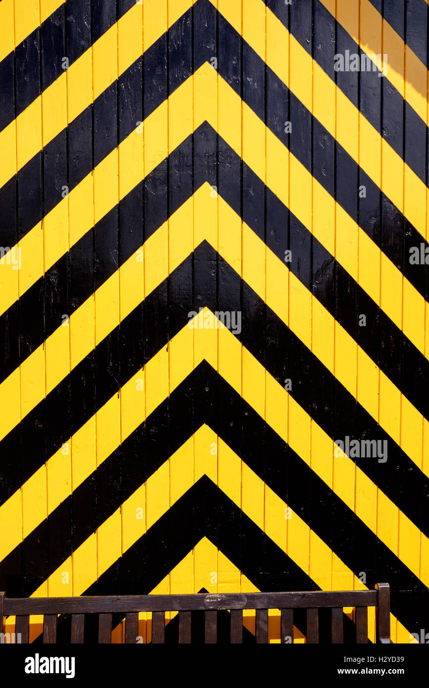Old engine shed door with black and yellow chevron stripes, National Railway Museum, York, UK Stock Photo