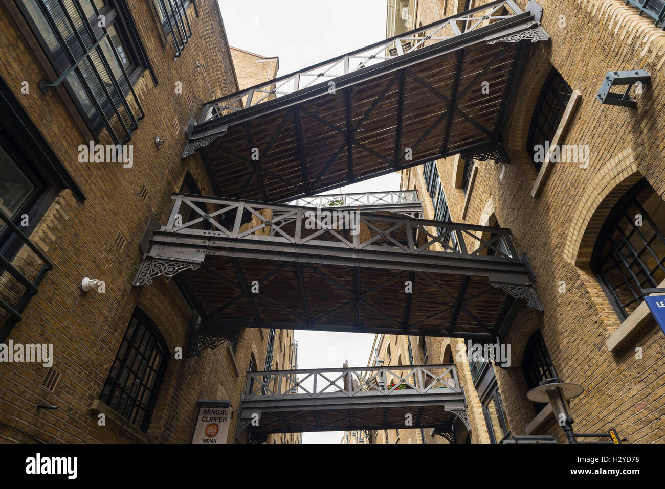 Connecting bridges over Shad Thames lane between the old Butler's Wharf warehouse building, London, UK Stock Photo