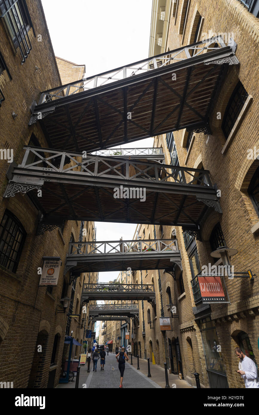 Connecting bridges over Shad Thames lane between the old Butler's Wharf warehouse building, London, UK Stock Photo