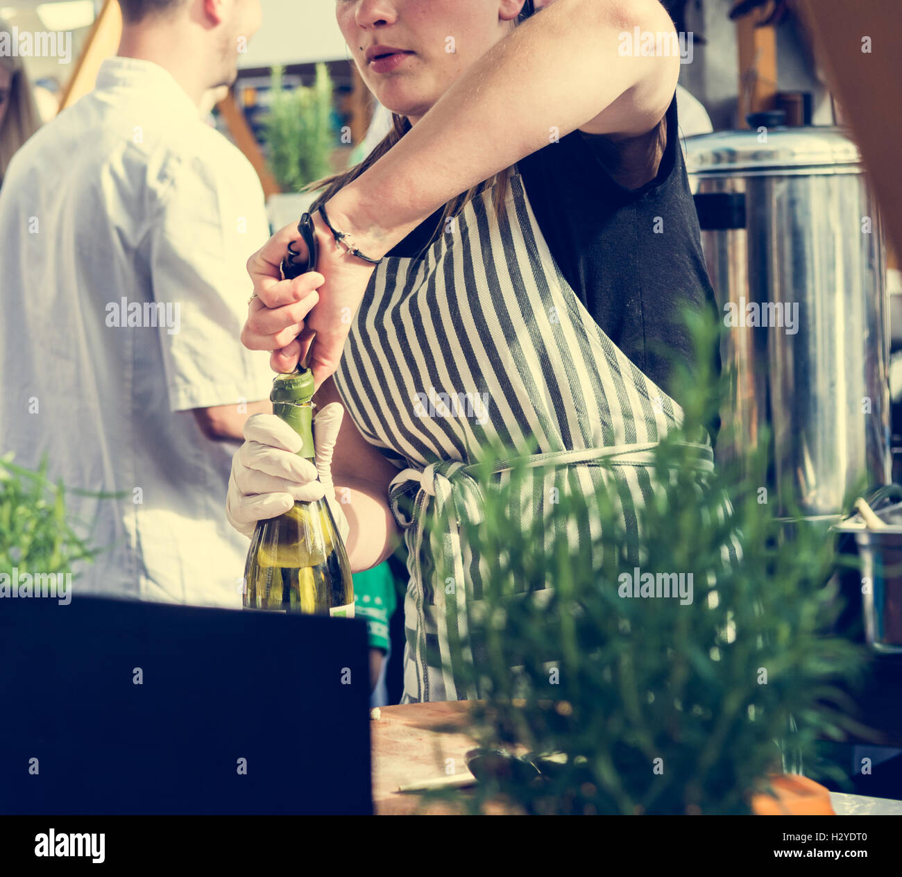Bartender opening a wine bottle Stock Photo Alamy
