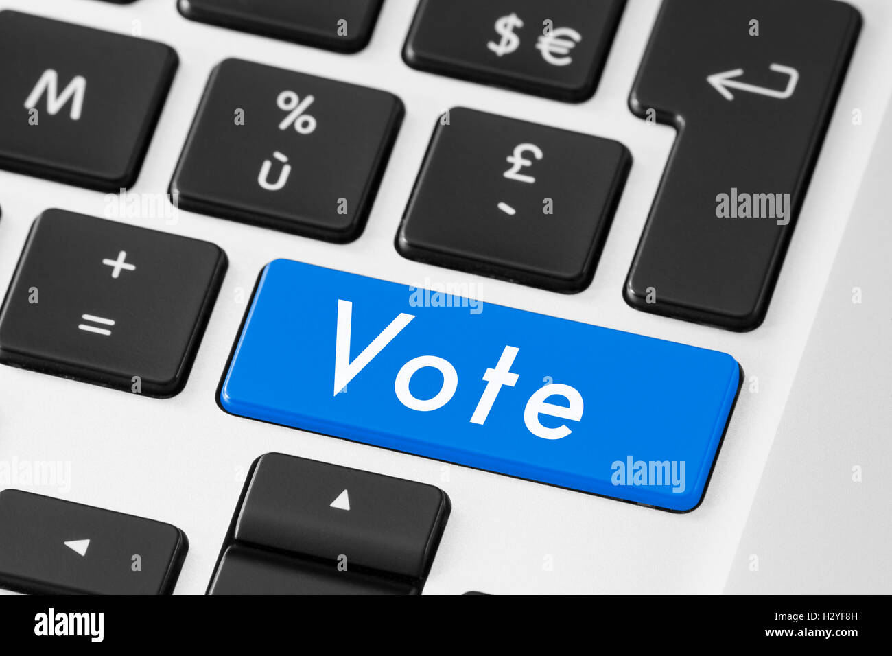 Vote button on keyboard for online electronic election Stock Photo