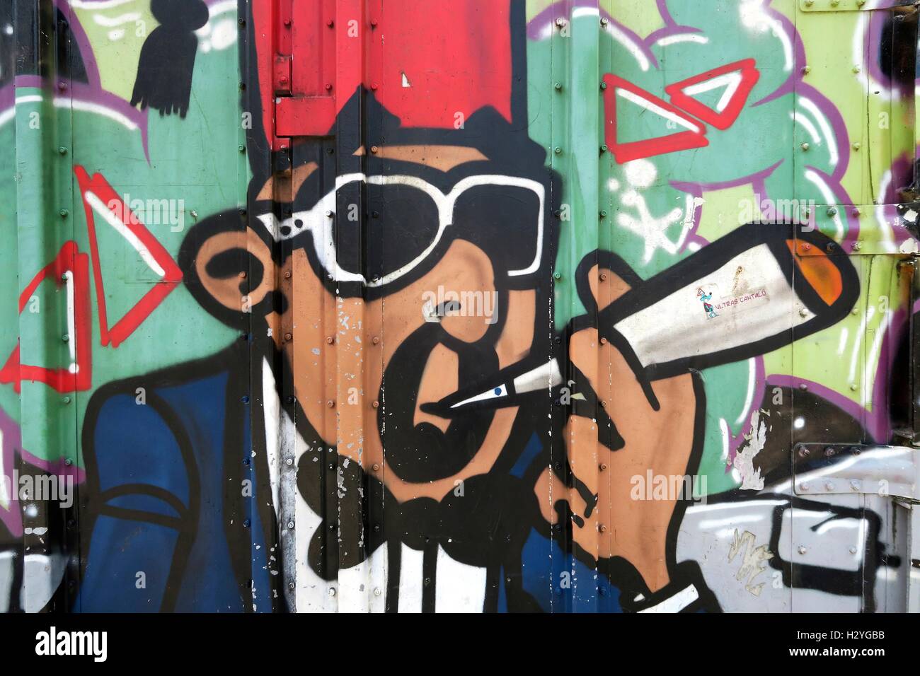Graffiti of a marijuana smoker, Freetown Christiania, Fristad Christiania, alternative residential area, Christianshavn Stock Photo