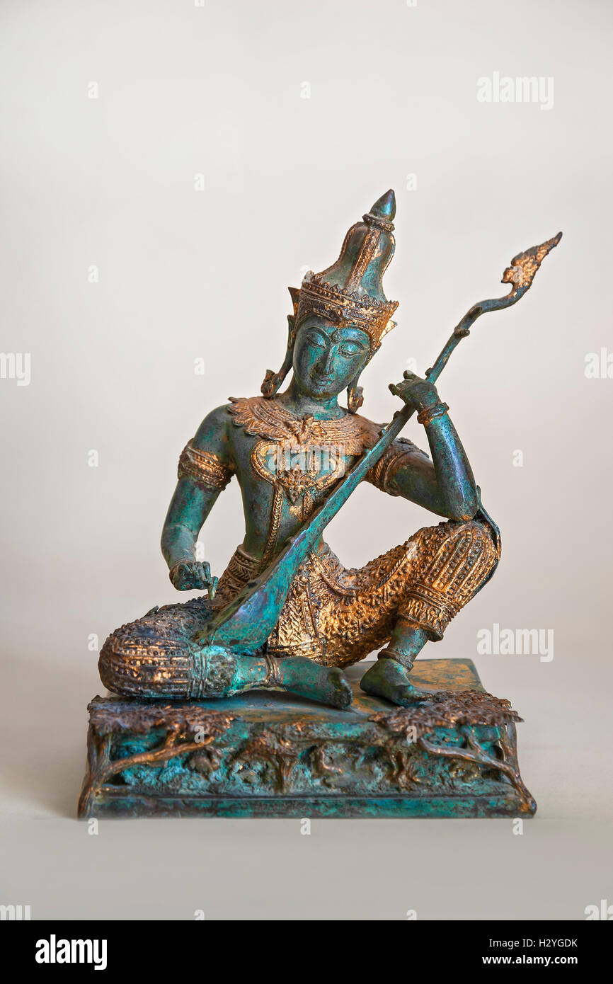 Bronze Sculpture, Thai figure, playing a sitar, Thailand Stock Photo