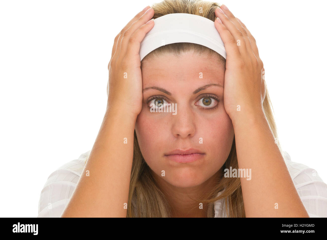 Young woman holding her head in her hands, depression Stock Photo