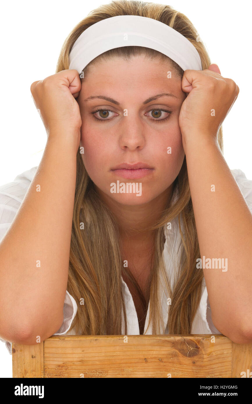 Young woman holding her head in her hands, depression Stock Photo