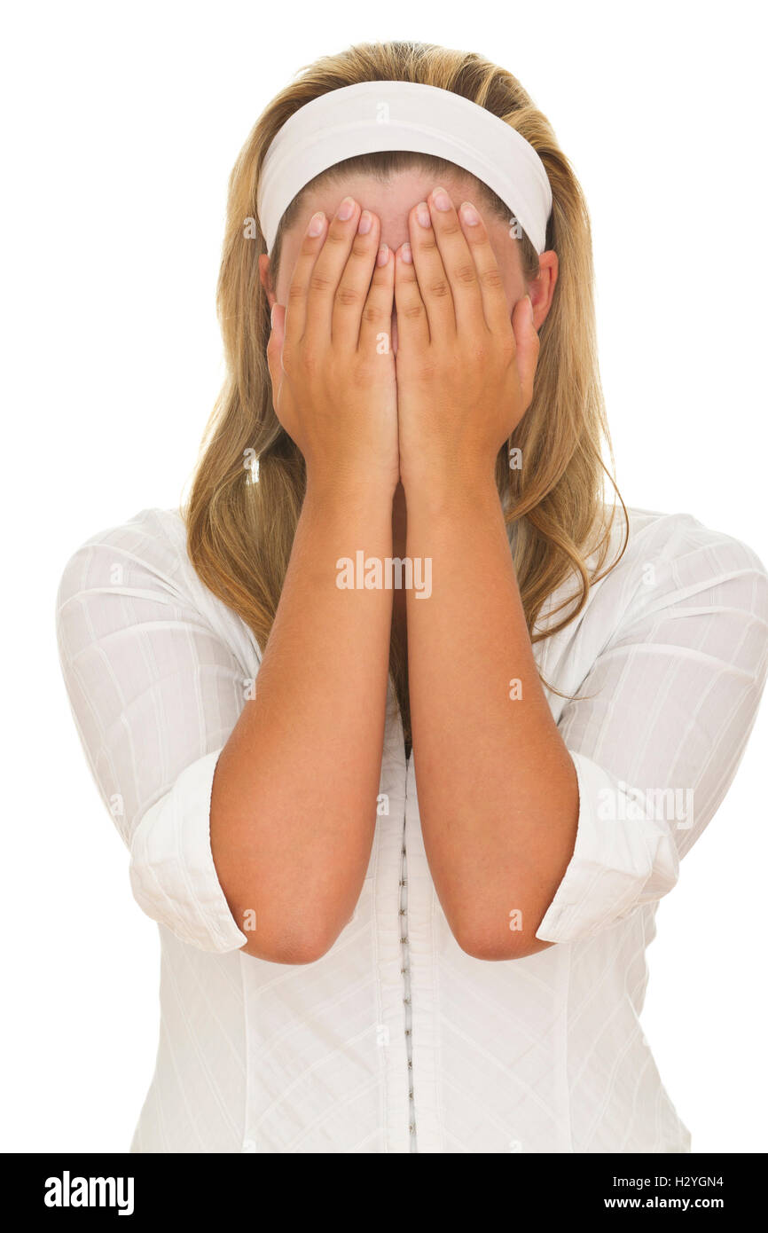 Young woman holding her hands in front of her face Stock Photo