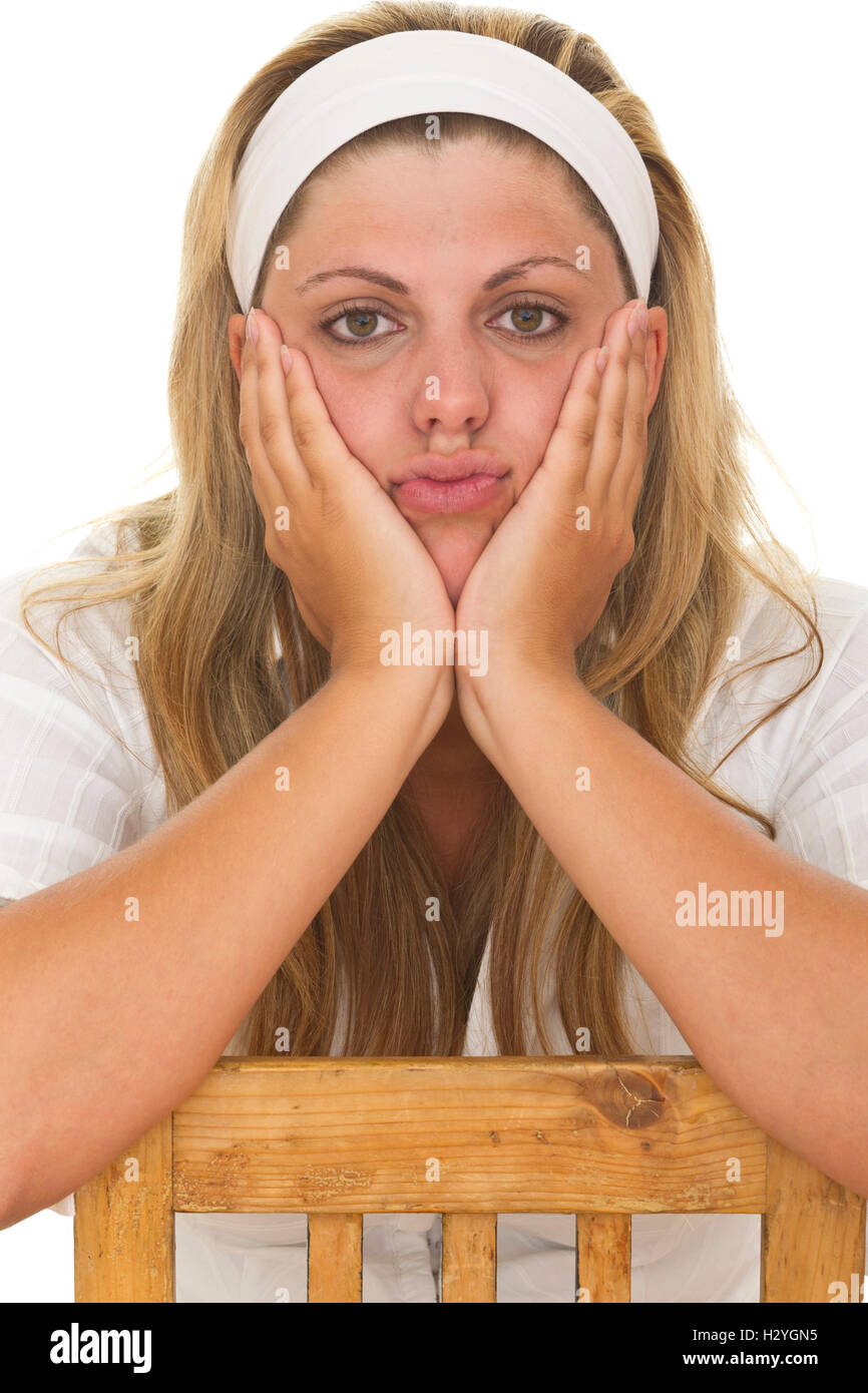 Young woman resting her face in her hands Stock Photo Alamy