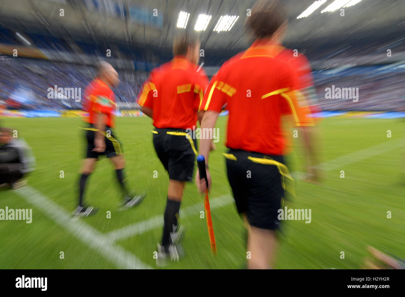 Referee and linesmen walking on to the pitch, Liga total Cup 2010, League total Cup, final between FC Schalke 04 and FC Bayern Stock Photo