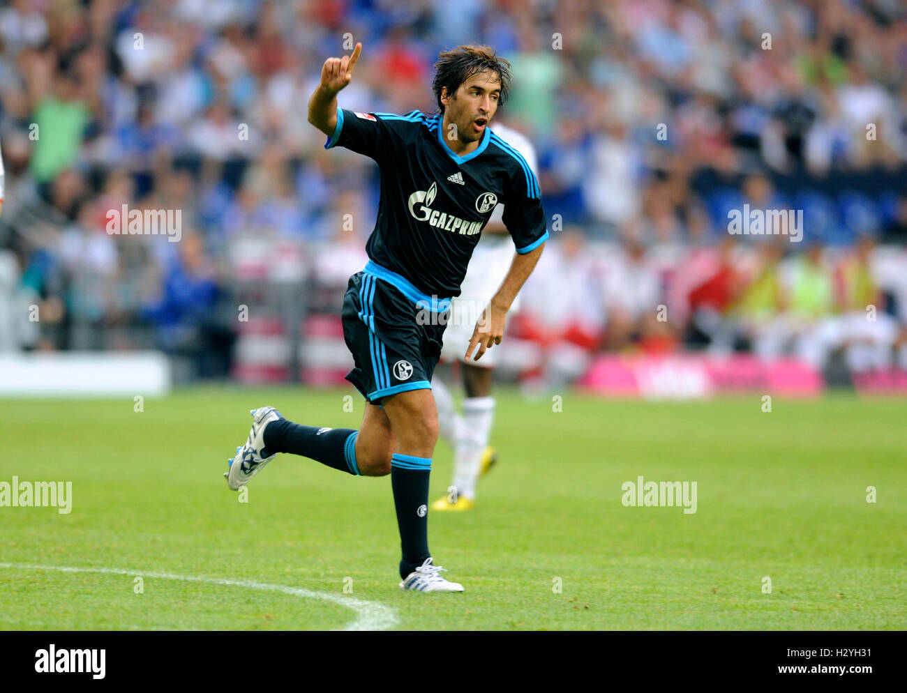 Football player Raul cheering after scoring final goal, end result Schalke 3, Bayern Munich 1, Liga total Cup 2010, League total Stock Photo