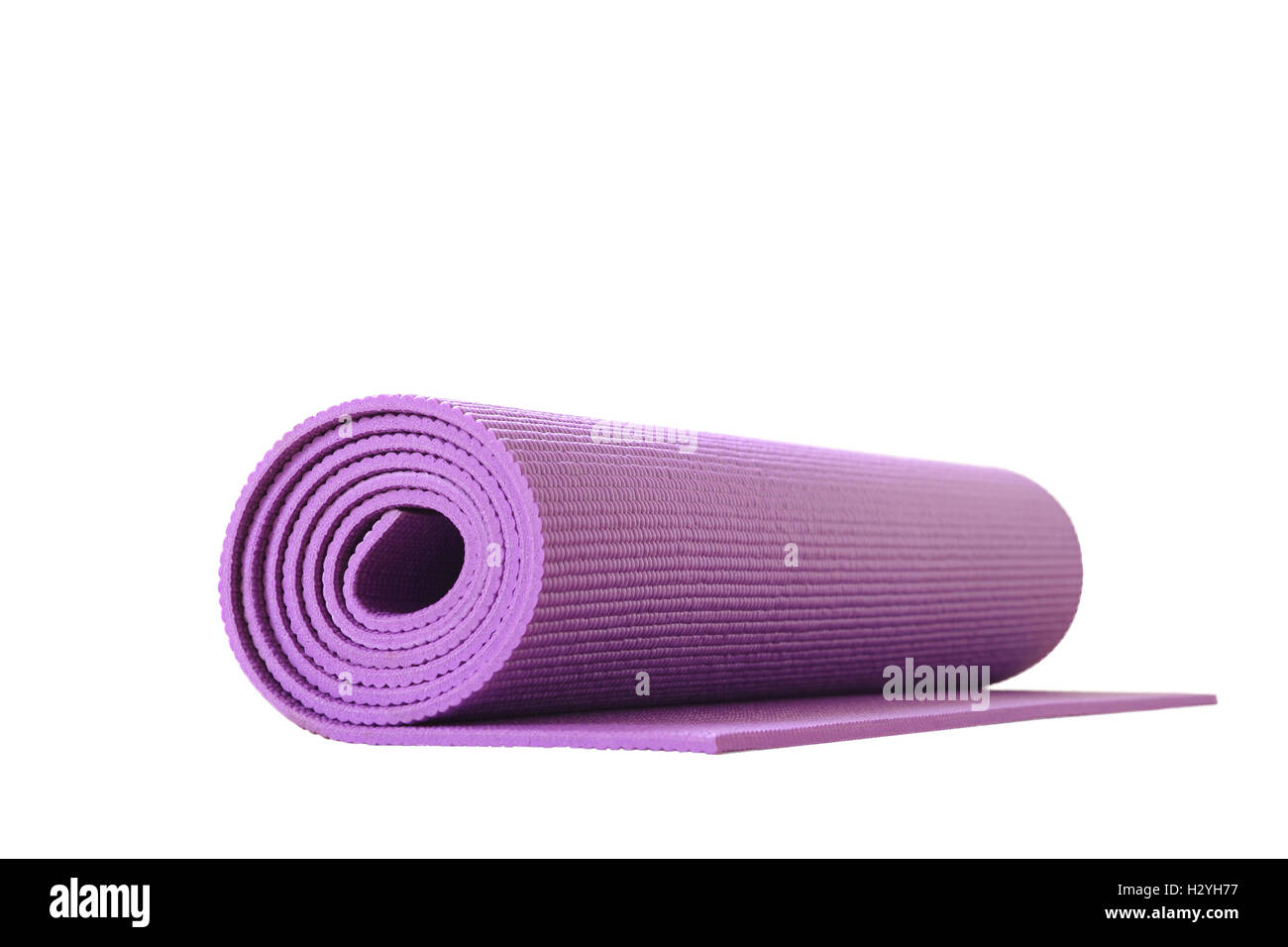 top view yoga mat roll on black rubber background, Purple yoga mat