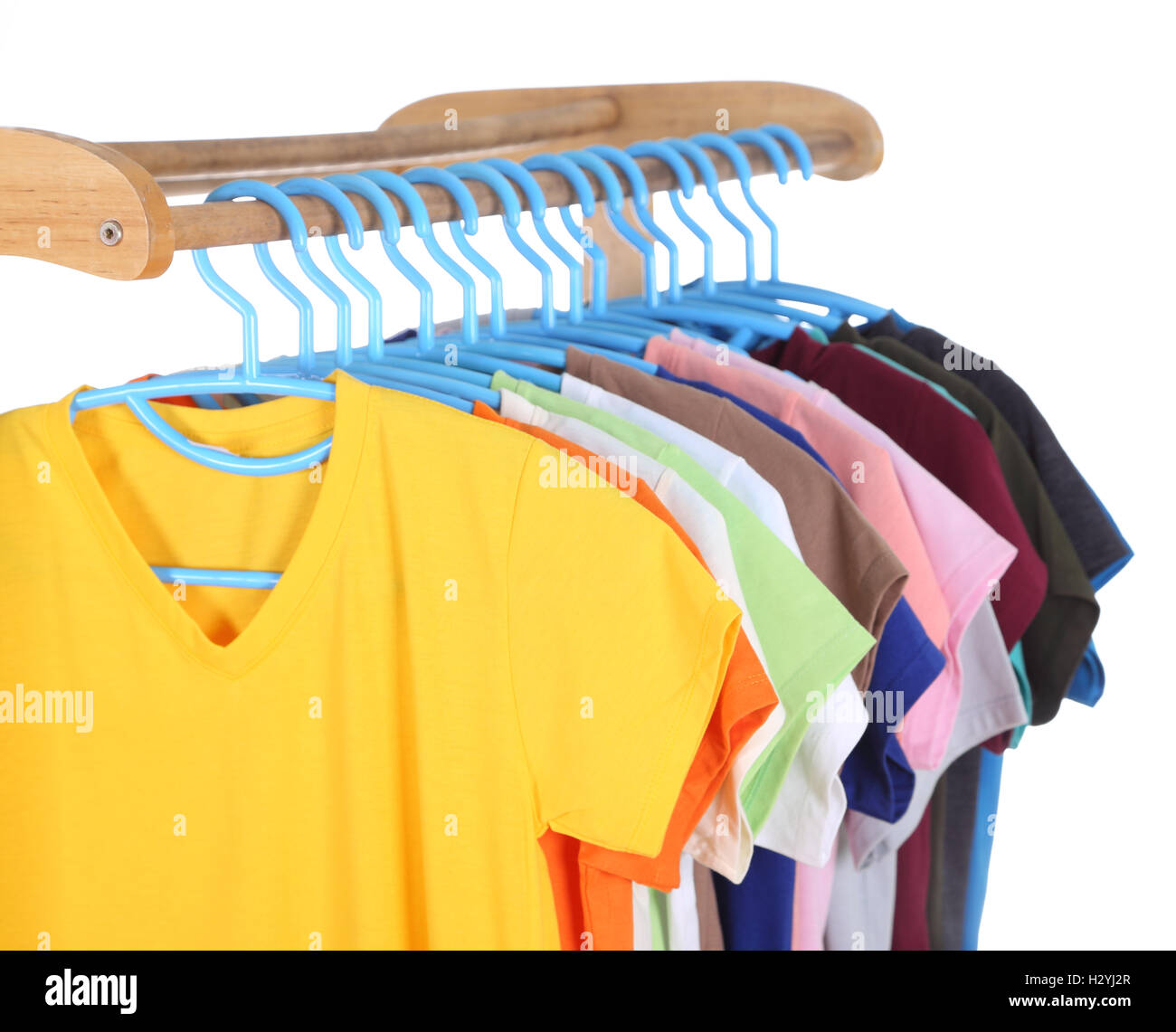 t-shirts hanging on hangers Stock Photo - Alamy