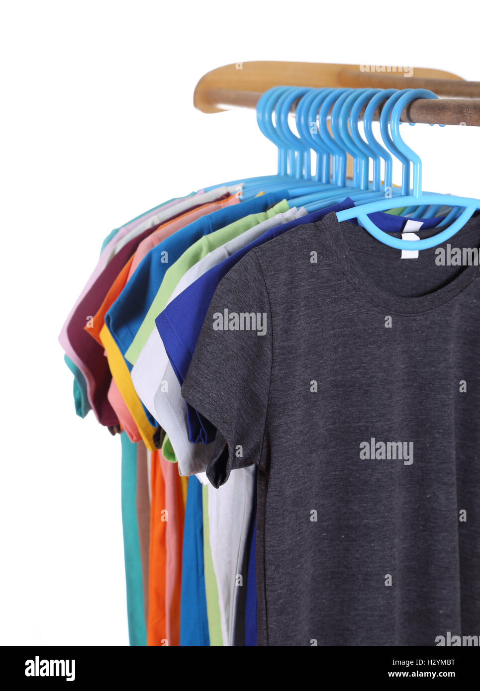 t-shirts hanging on hangers Stock Photo - Alamy