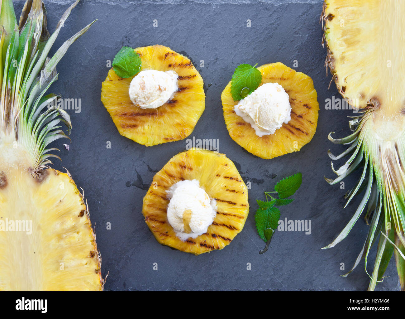 Grilled pineapple with ice cream Stock Photo Alamy
