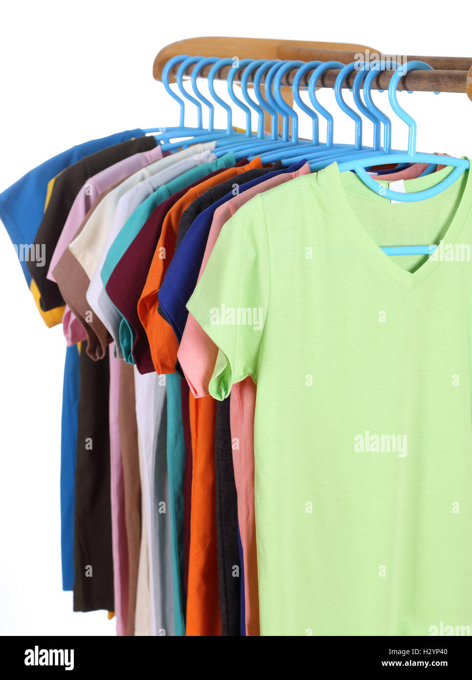 t-shirts hanging on hangers Stock Photo - Alamy