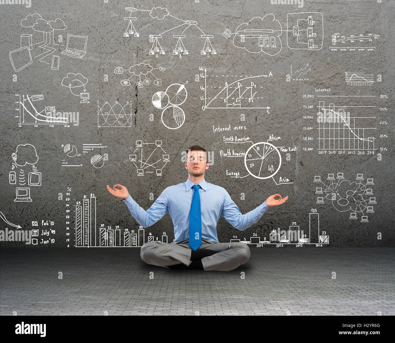 business man meditating on floor Stock Photo - Alamy