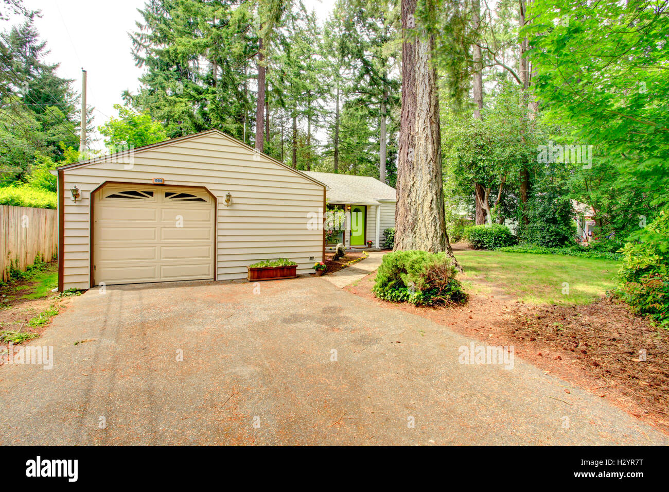 Countryside house. Garage with driveway Stock Photo Alamy