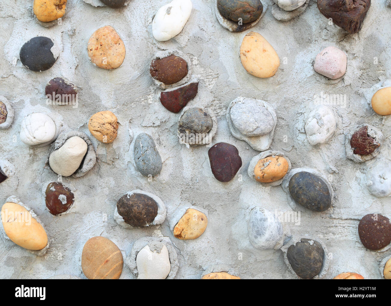 Picture of Pebbles in concrete wall texture Stock Photo - Alamy