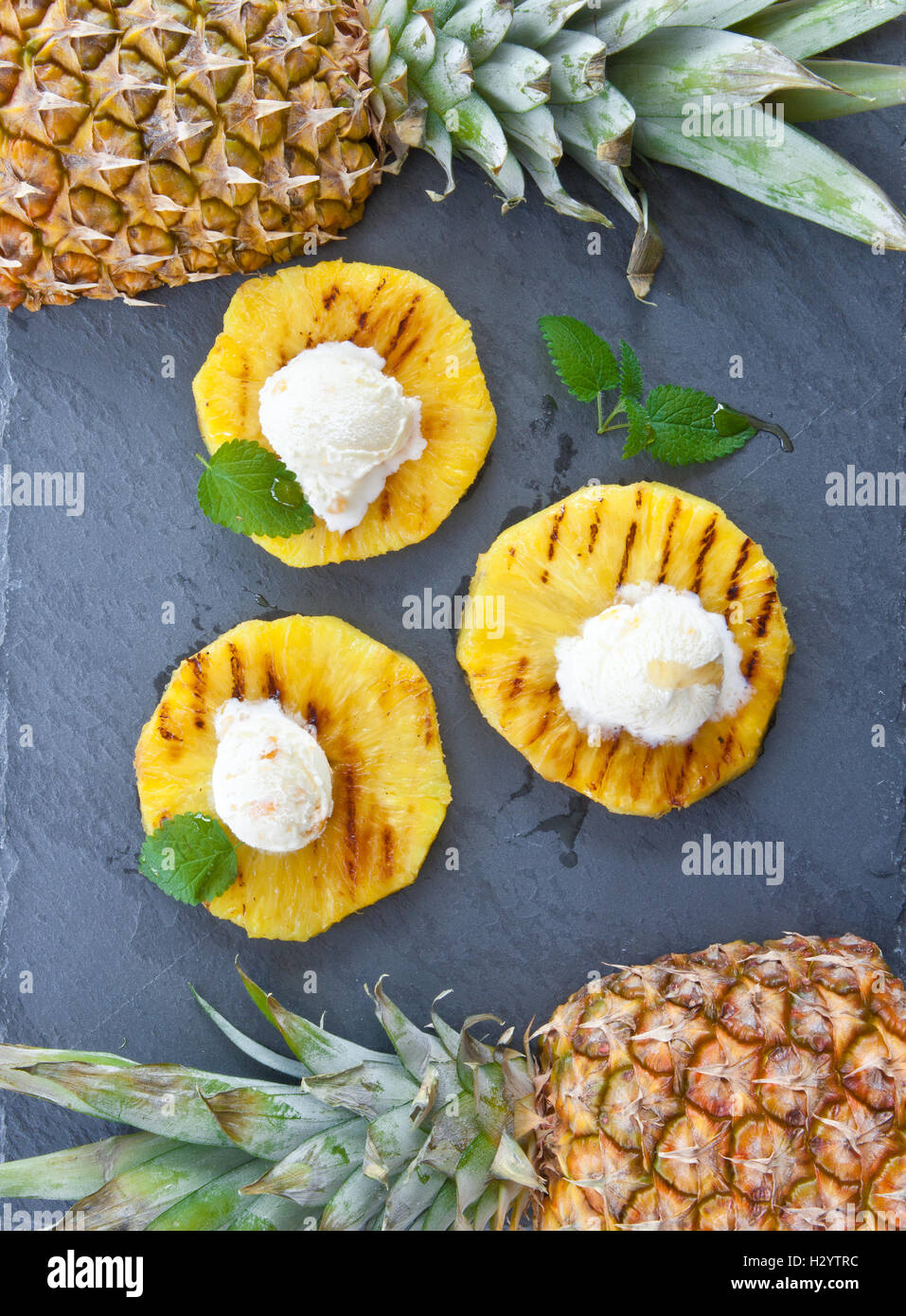 Grilled pineapple with ice cream Stock Photo Alamy