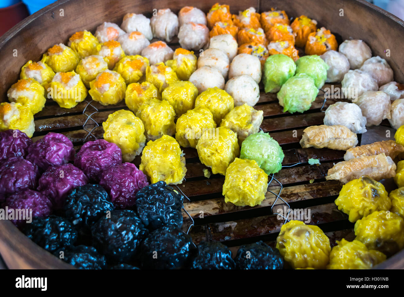 dim sum, colorful Chinese steamed dumplings in Chinatown Stock Photo