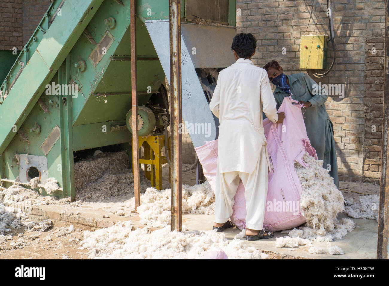 Men working in cotton mill Multan  Pakistan Stock Photo